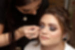 Beautiful bride having her makeup done