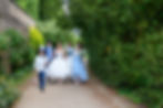 Mad Hatter wedding party walking down Newstead abbey path
