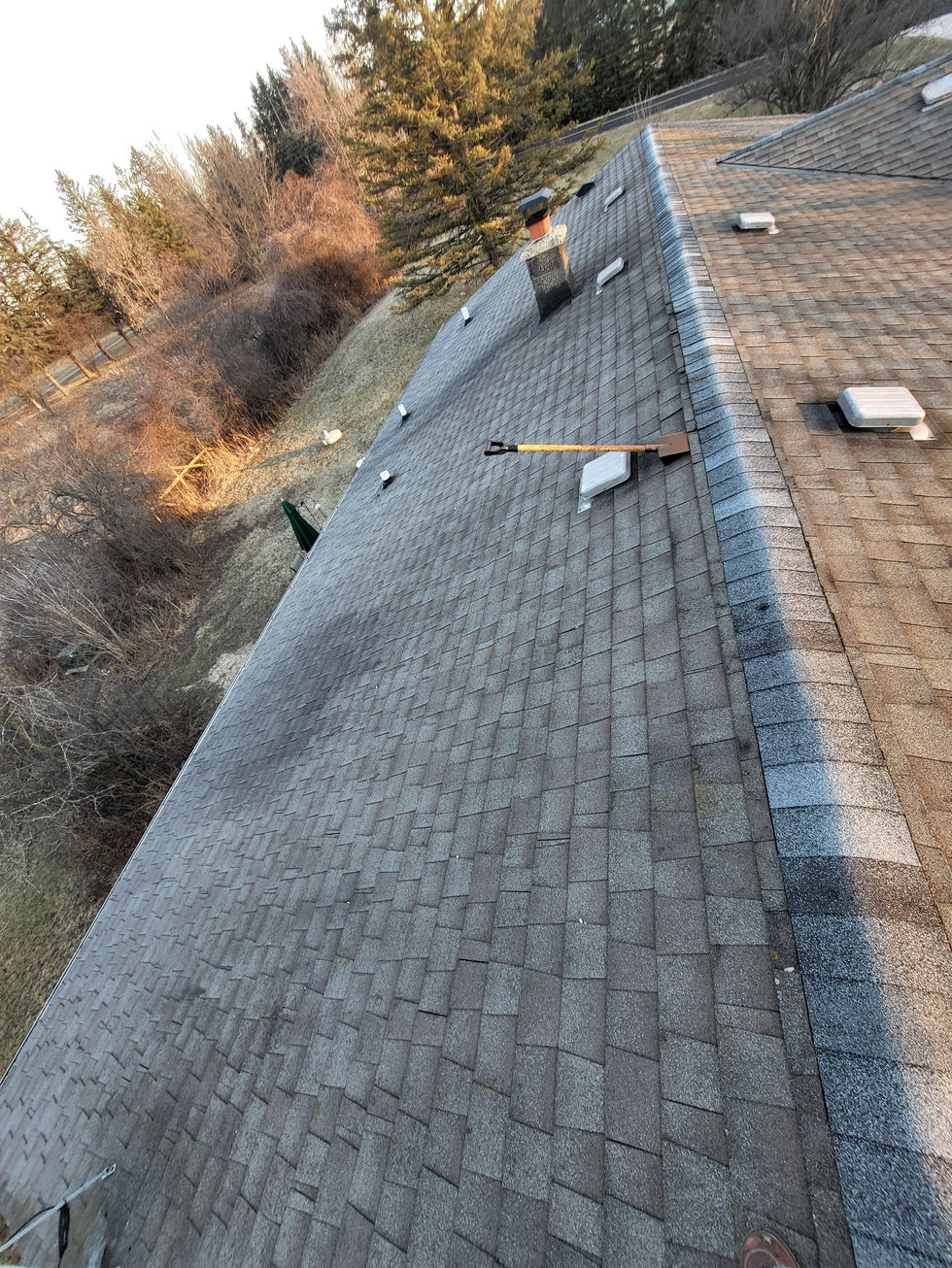 Worn residential roof in Washington County prior to tear-off with visible aging shingles