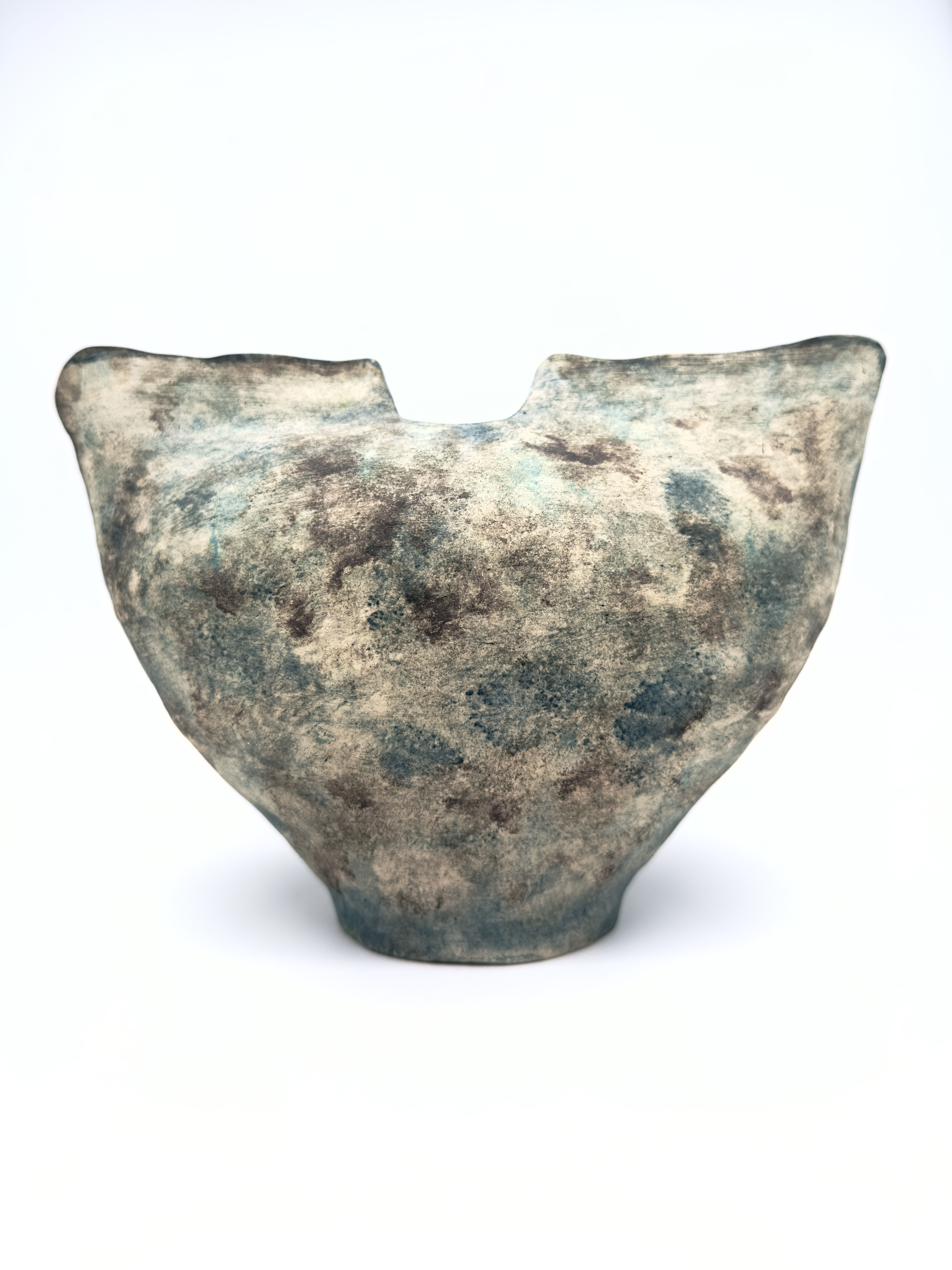 Textured ceramic vessel with a unique shape, Memory Vessel 0033, on white background.