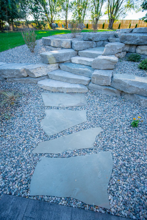Custom front door walkway with stone accents in Ann Arbor