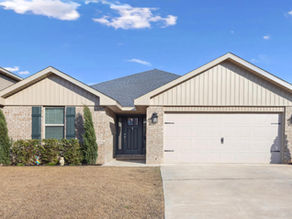 Crestview Florida home tour featuring all-brick house with open layout, modern kitchen, EV charger, and spacious backyard near Eglin Air Force Base