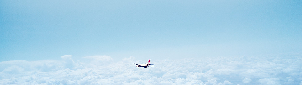 Airplane Above the Clouds