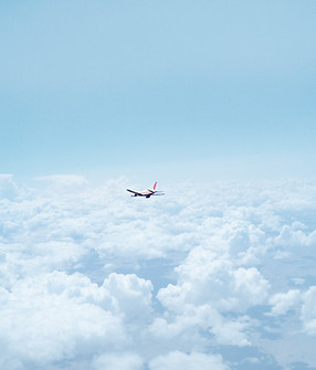 Airplane Above the Clouds
