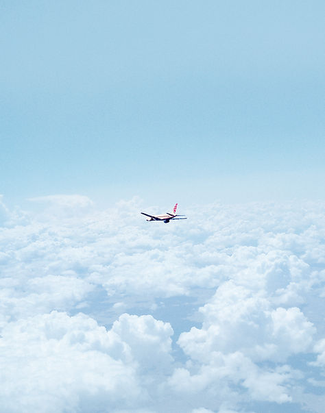 Airplane Above the Clouds