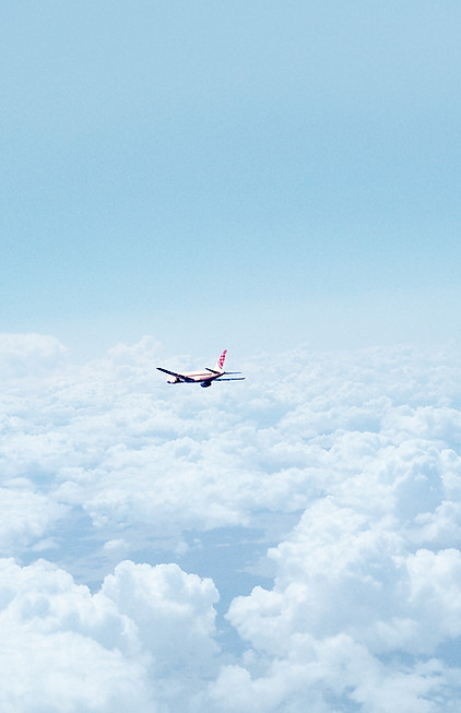 Airplane Above the Clouds
