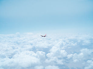 Airplane Above the Clouds
