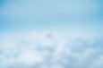 Airplane Above Clouds