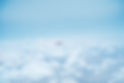 Airplane Above the Clouds