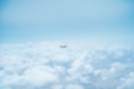 Airplane Above the Clouds
