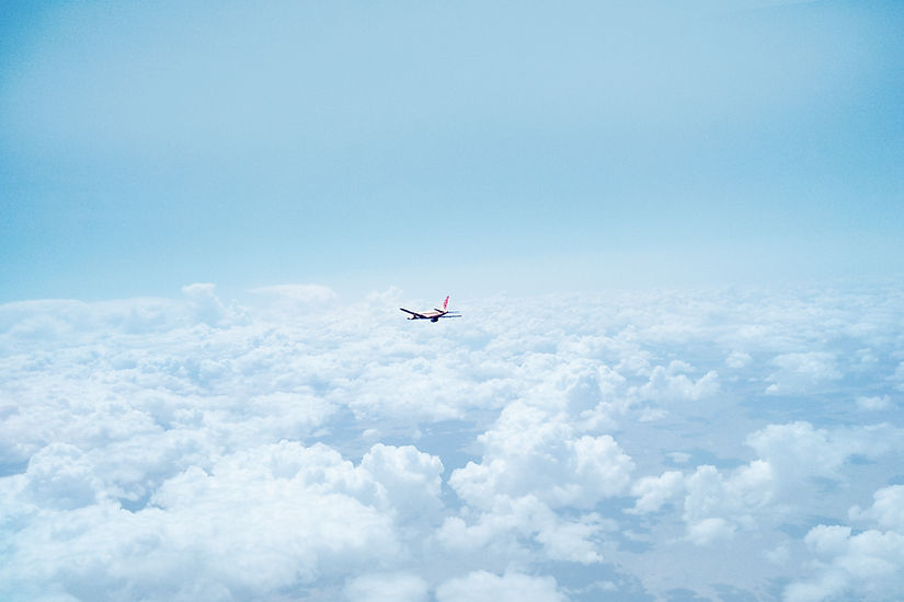 Airplane Above the Clouds