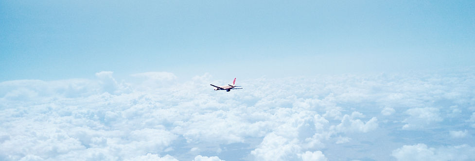 Airplane Above the Clouds