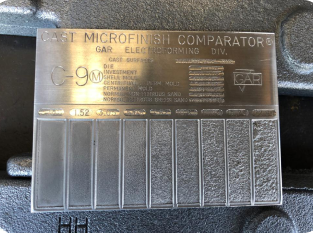 A surface finish comparator used to evaluate and compare the texture and roughness of machined surfaces, ensuring quality and precision in manufacturing.