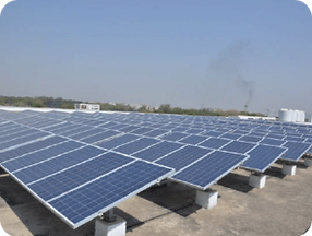 A solar plant installed on a terrace with multiple photovoltaic panels, harnessing solar energy for sustainable and efficient power generation.
