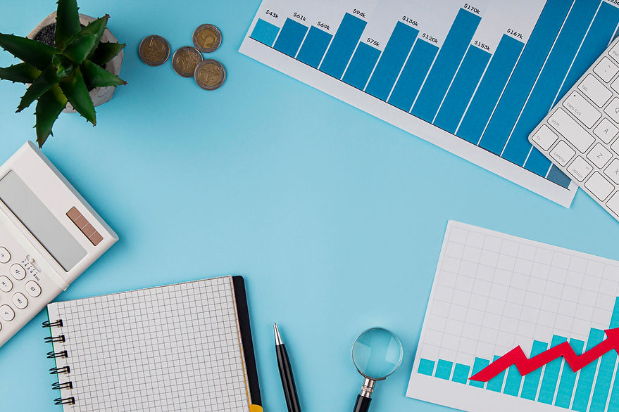 top-view-office-desk-with-growth-chart-coins.jpg