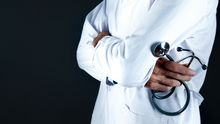 a physician assistant holding a stethoscope