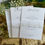 Thumbnail: Rustic white menu cards with guest name and floral band