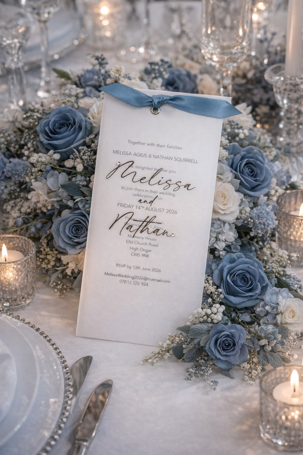 Wedding invitation with personalised vellum cover and dusky blue ribbon