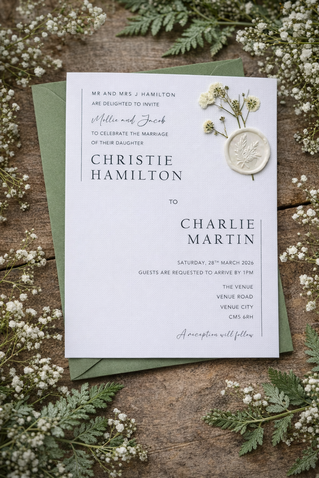 White wedding invitation with gypsophelia and wax seal