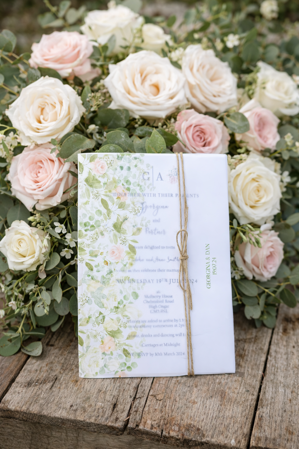 Wedding Invitation in vellum wallet with pale pink and white roses