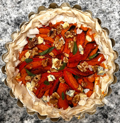 squash, gorgonzola, walnut and sage tart in the tin before baking