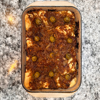 cooked pissaladière focaccia in baking dish