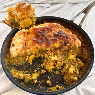 baked curried cauliflower cheese pie and a spoonful