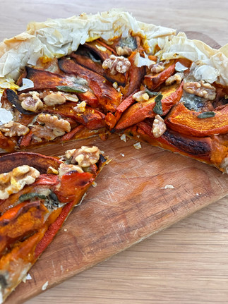 squash and gorgonzola tart with a slice cut out