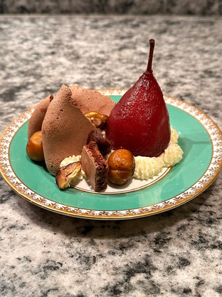 red wine poached pear, chestnut and chantilly pavlova plated in a more modern way