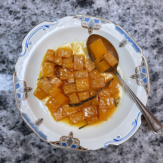 Glazed swede on a serving plate with spoon