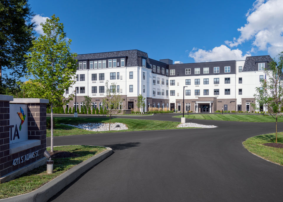 Front exterior of Vita of Marion senior living facility, showcasing modern architecture and landscaping