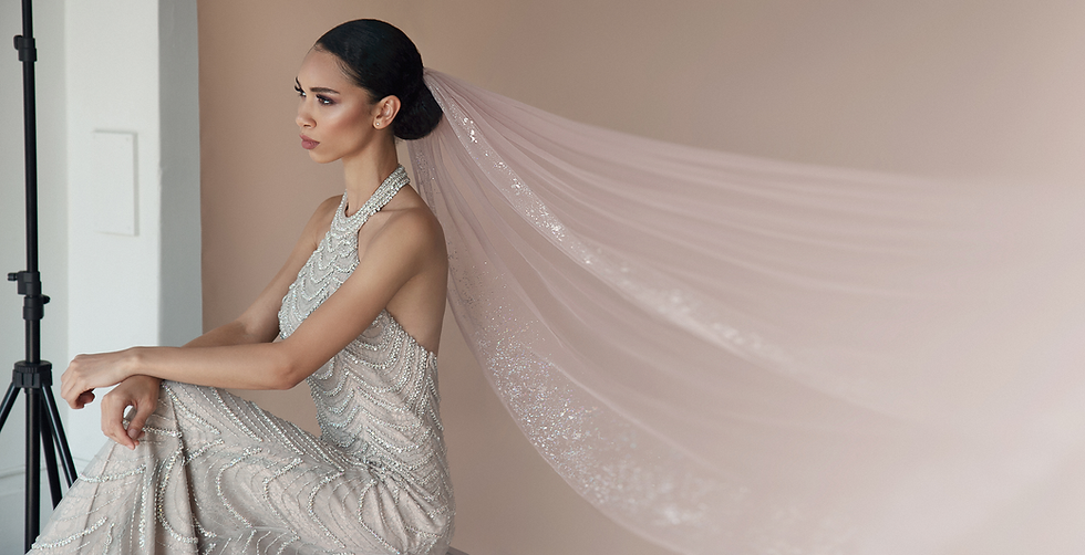 Bride with custom pink glitter comb veil from Flavelle & Co and luxury evening gown