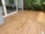 Modern wood deck outside a glass sliding door