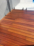 Polished timber deck with glass fencing in Ashwood.