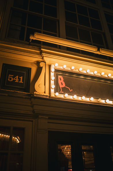 Live jazz performance on stage at Beehive Boston, musicians playing to a packed crowd
