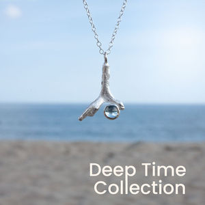 Handcrafted silver coral pendant with sky blue Topaz gemstone.
