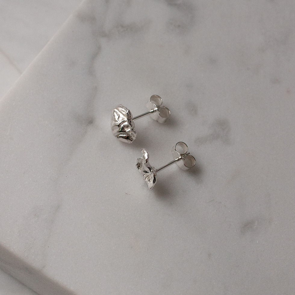 Thumbnail: Pair of silver studs handcrafted seen from above