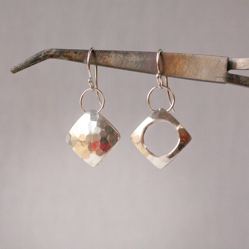 Pair of asymmetric hammered silver pillow earrings