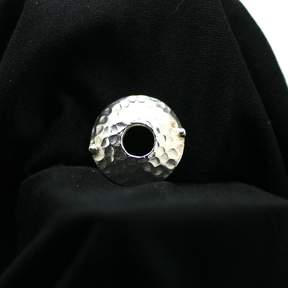 Thumbnail: Karen Hill Tribe Silver beads in a hollow circular shape with central hole and a hammered texture