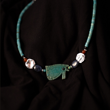 Bespoke handmade necklace with semi precious stones and ancient Egyptian Horus Eye amulet by Harmattan Jewellery