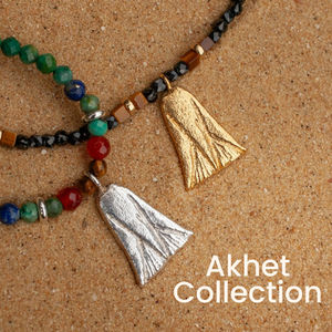 Gemstone necklaces featuring silver and gold casts of an ancient Egyptian Lotus amulet.