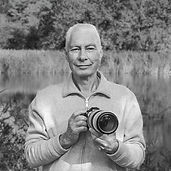 Photographer Ben Ovesen outdoors in a natural landscape.