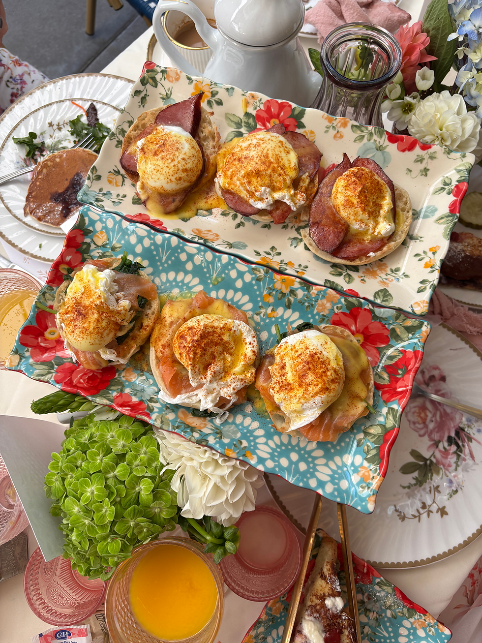 2 trays of Eggs Benedict on floral plates, ham and eggs Benedict, smoked salmon eggs Benedict topped with paprika best eggs Benedict echo park
