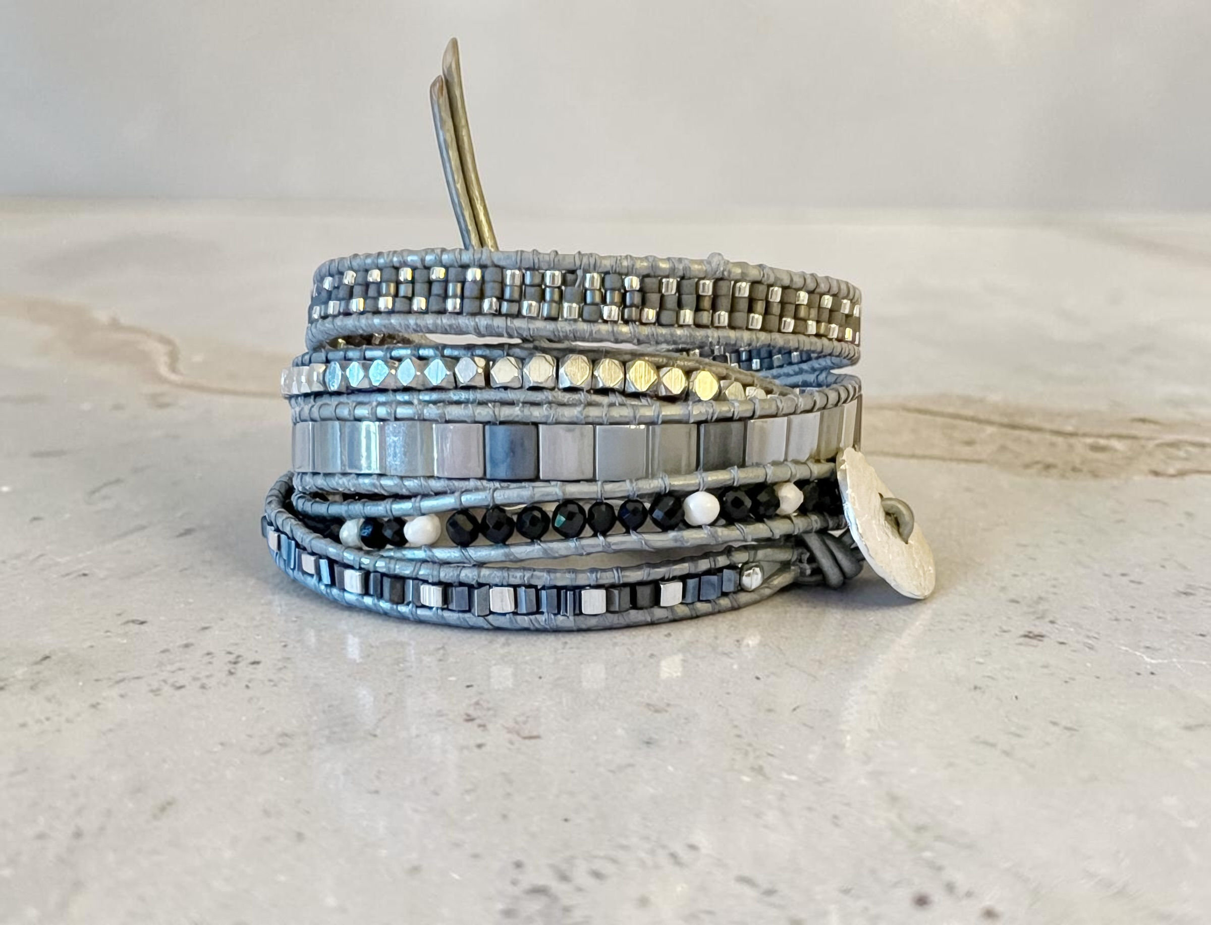 black spinel and silver 5 wrap leather bracelet front view