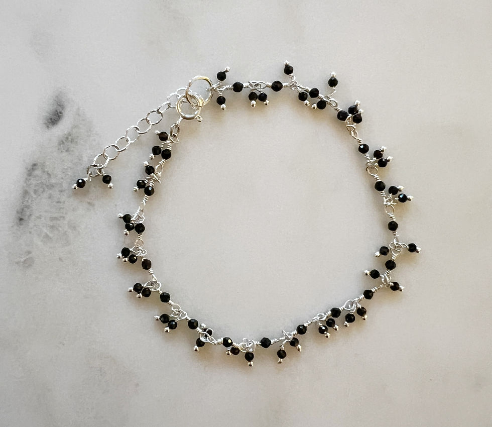 Thumbnail: black spinel dainty dangle chain bracelet, overhead view