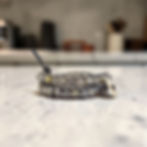 double leather wrap bracelet on gray leather with labradorite on counter