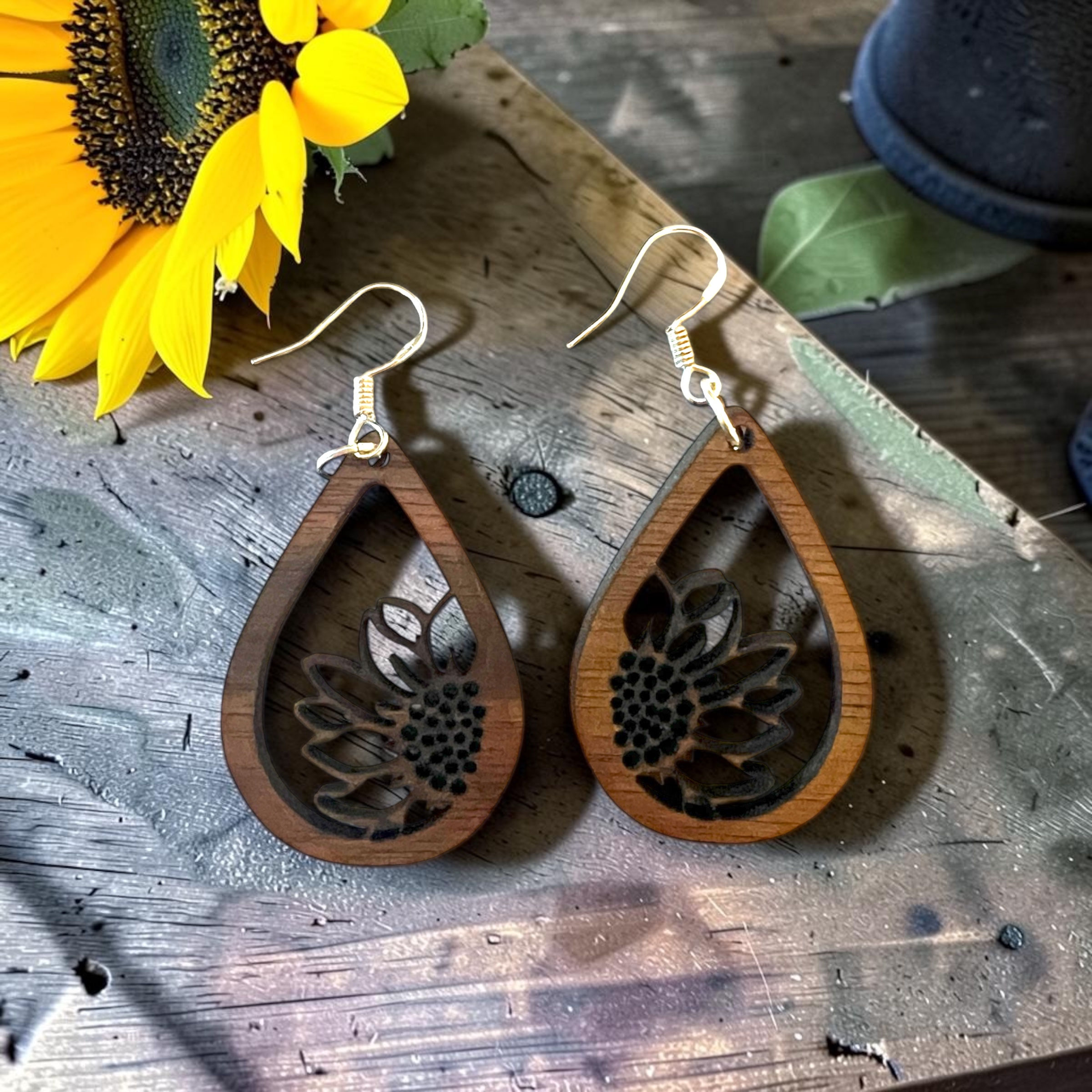 sunflower wood earrings laser cut on counter