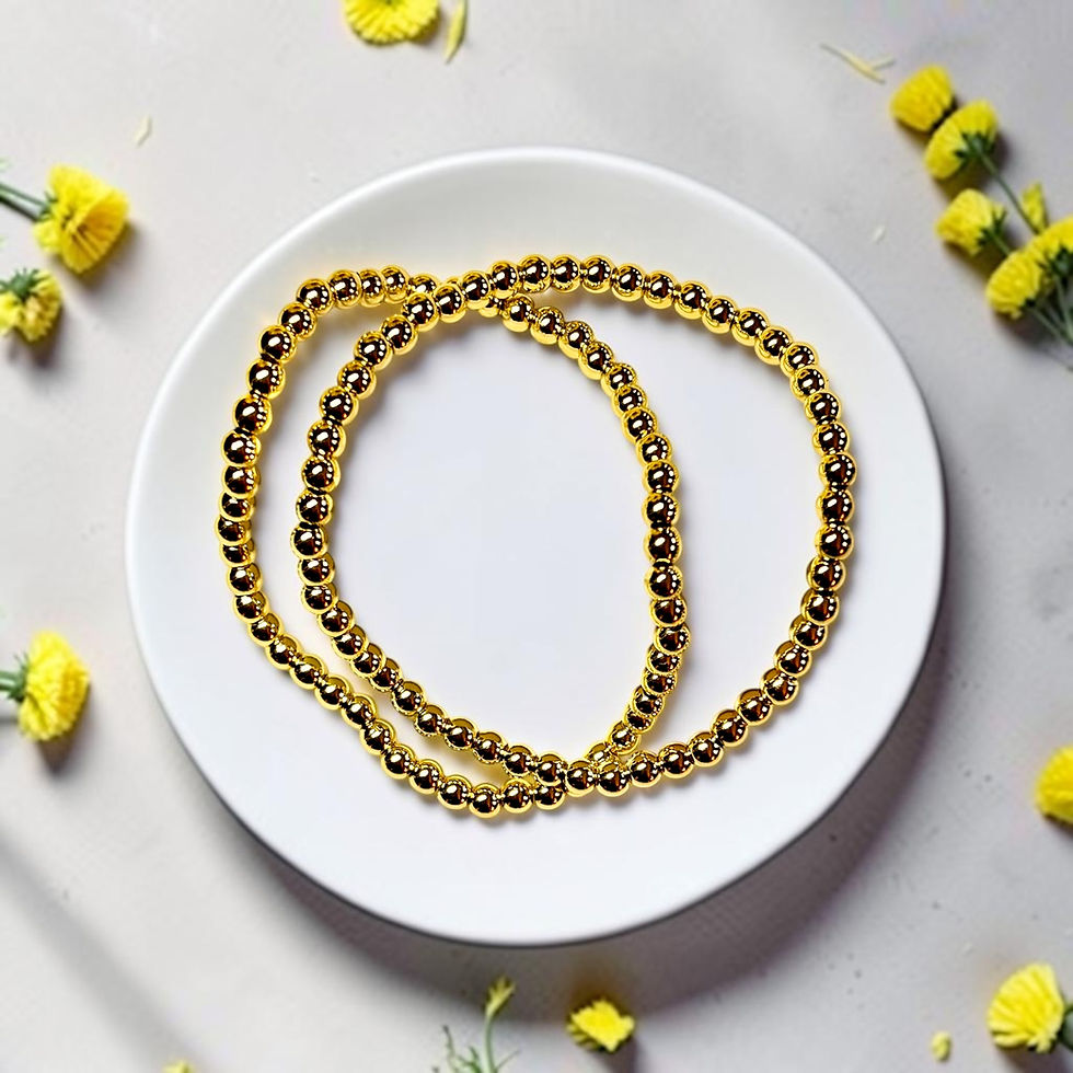 gold fill beaded bracelets on plate with flowers