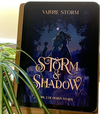 Book cover of Storm and Shadow. Kari and Raven in the foreground in a nightly forest setting.