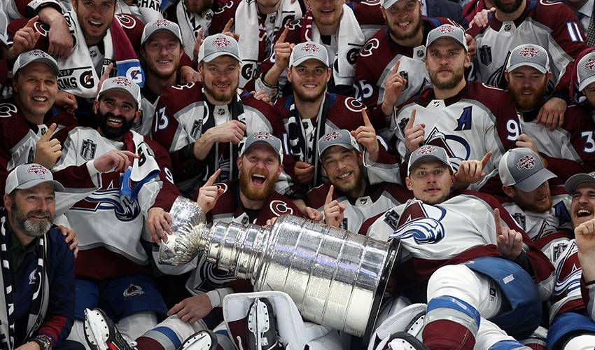 The Colorado Avalanche Gathering Around The Stanley Cup
